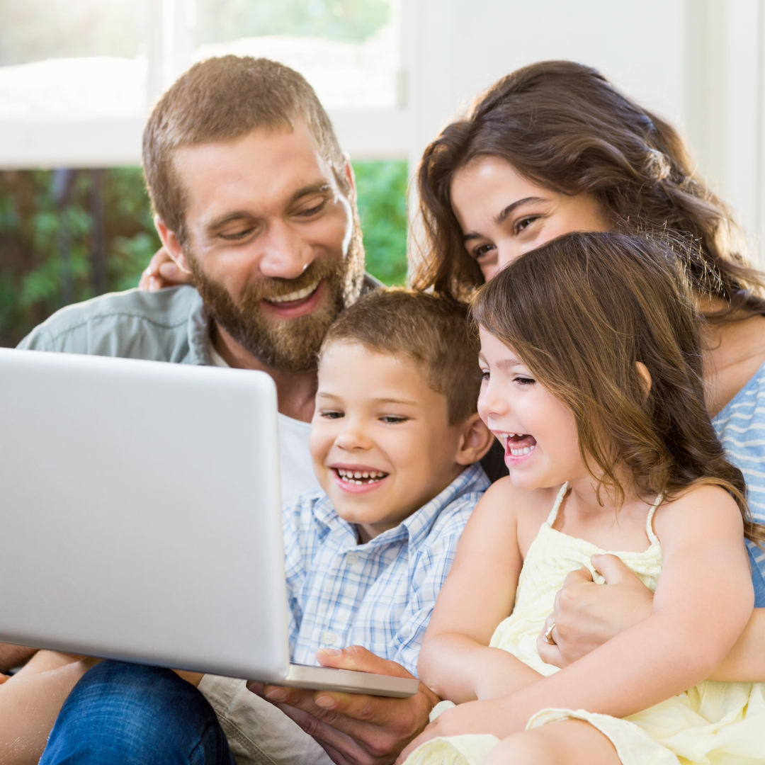 Happy family using a computer together