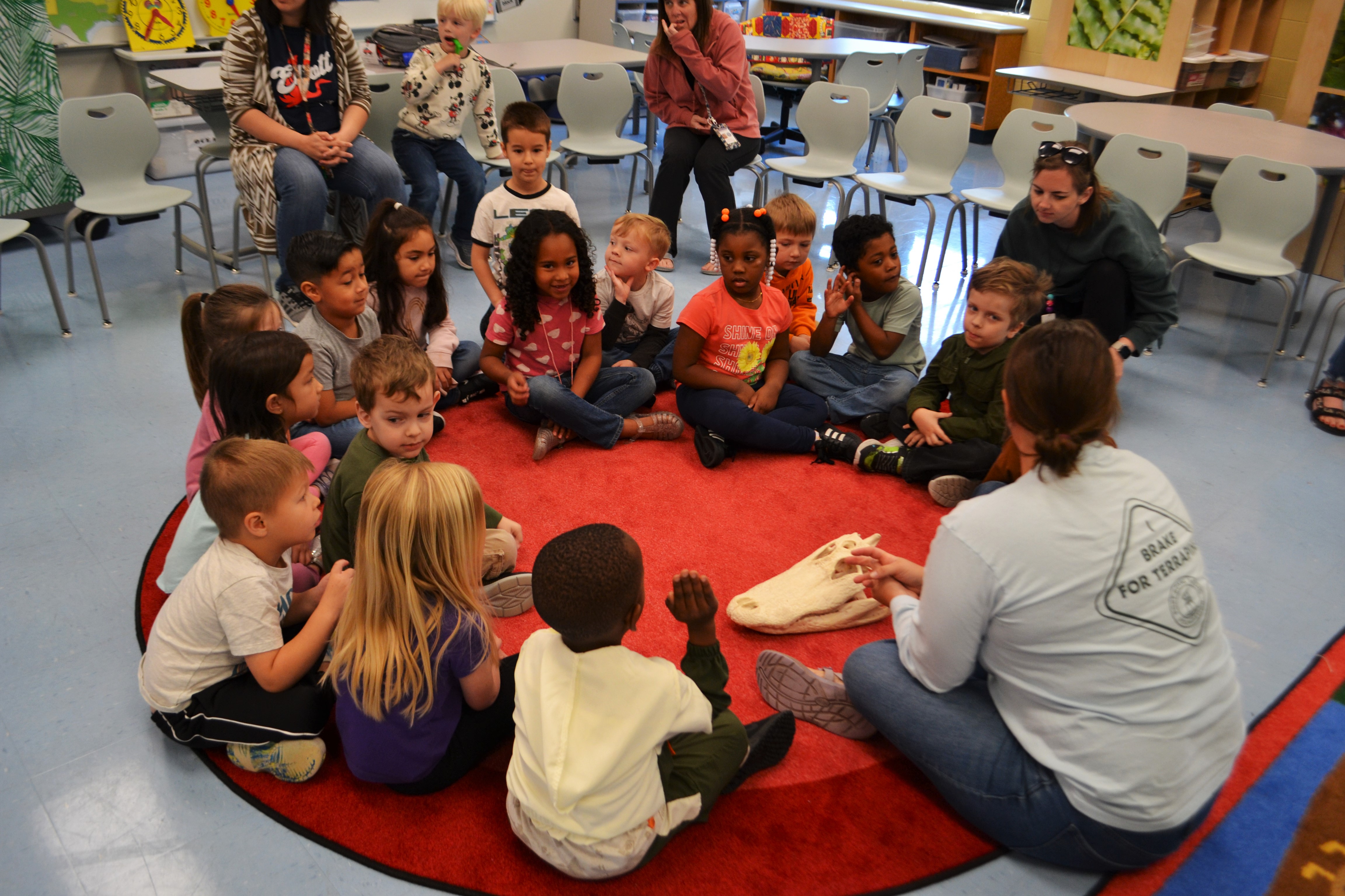PK Students sitting around alligator skull