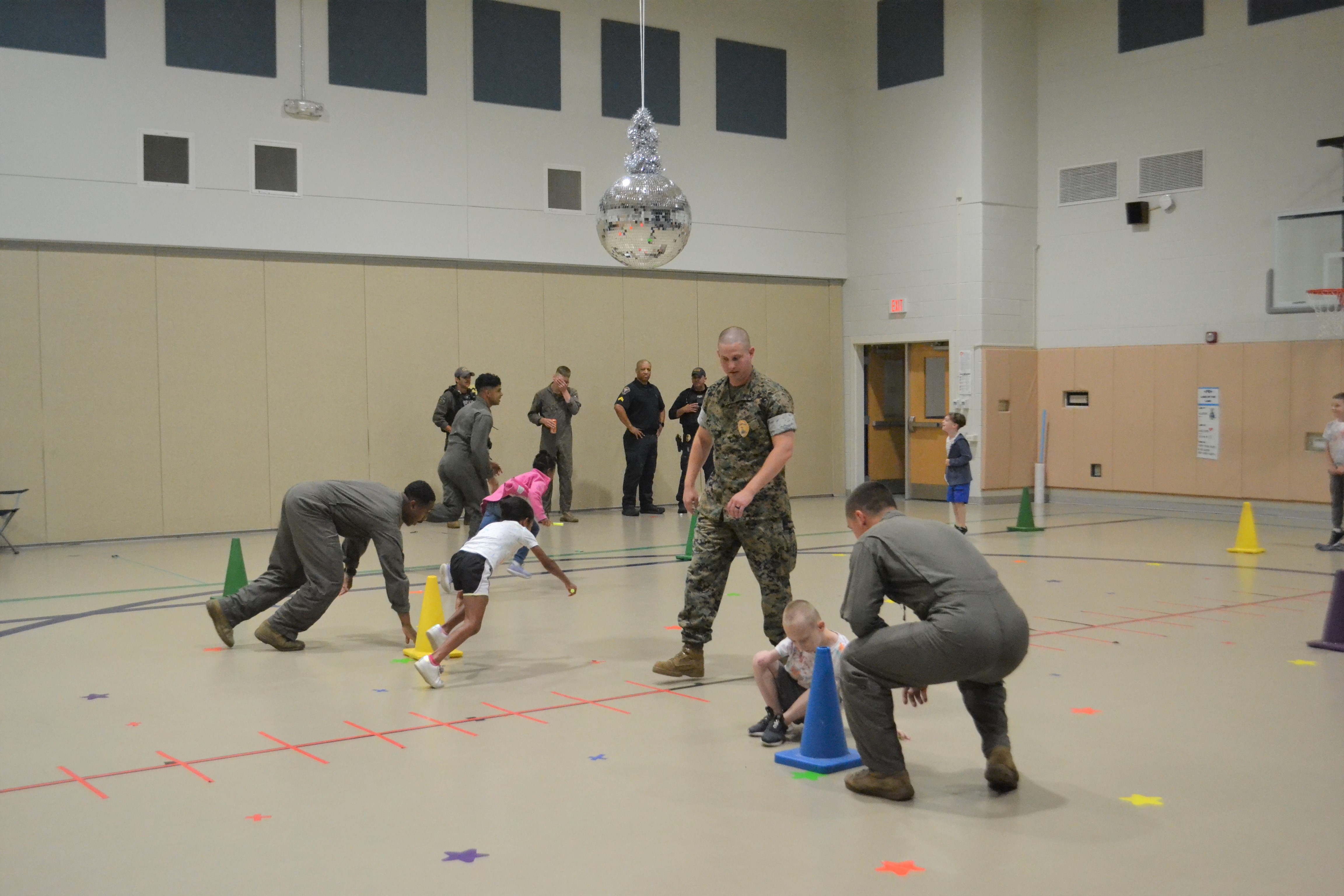 Marines lead students in a relay race