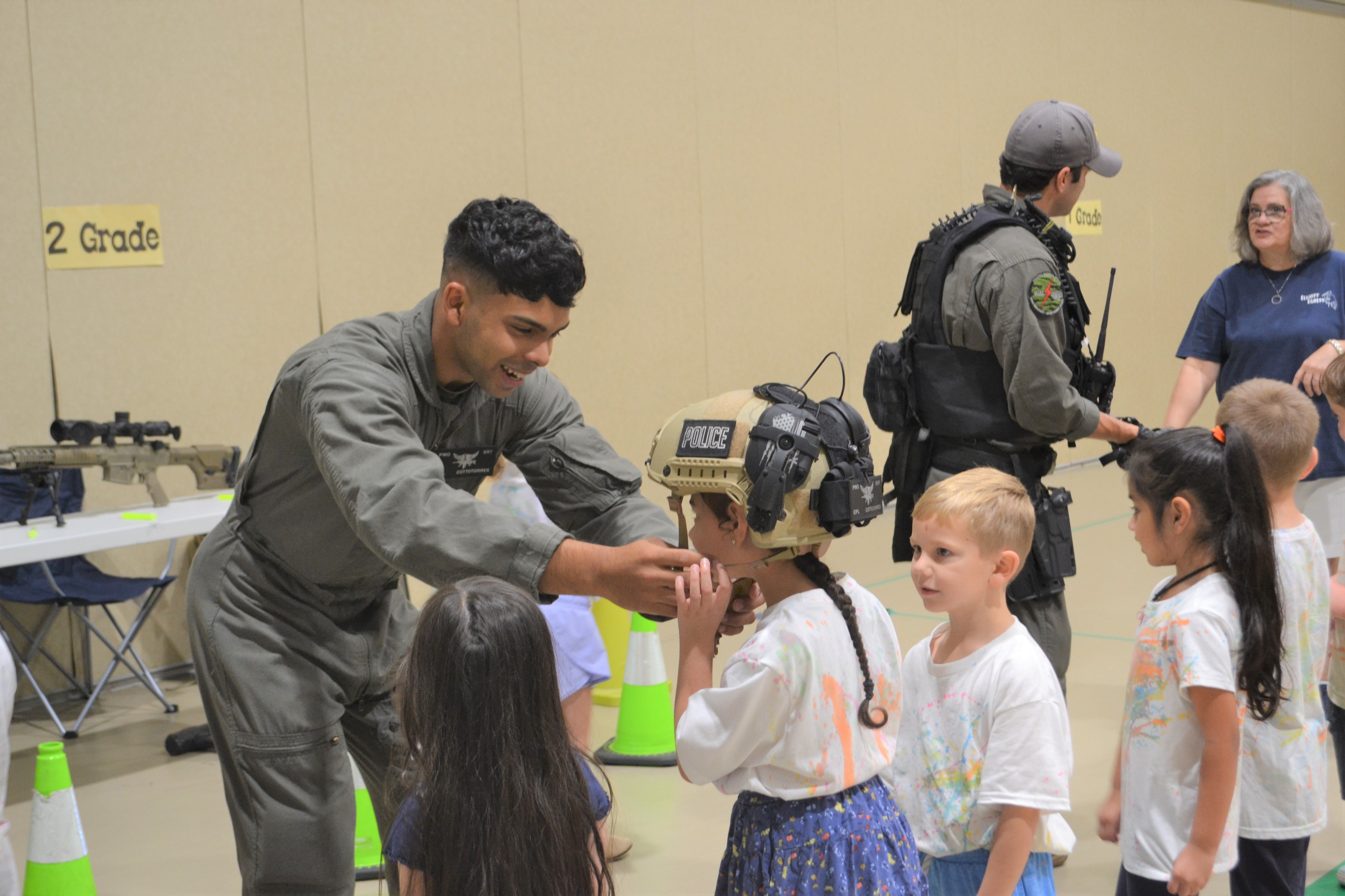 A student tried on a Marine's helmet