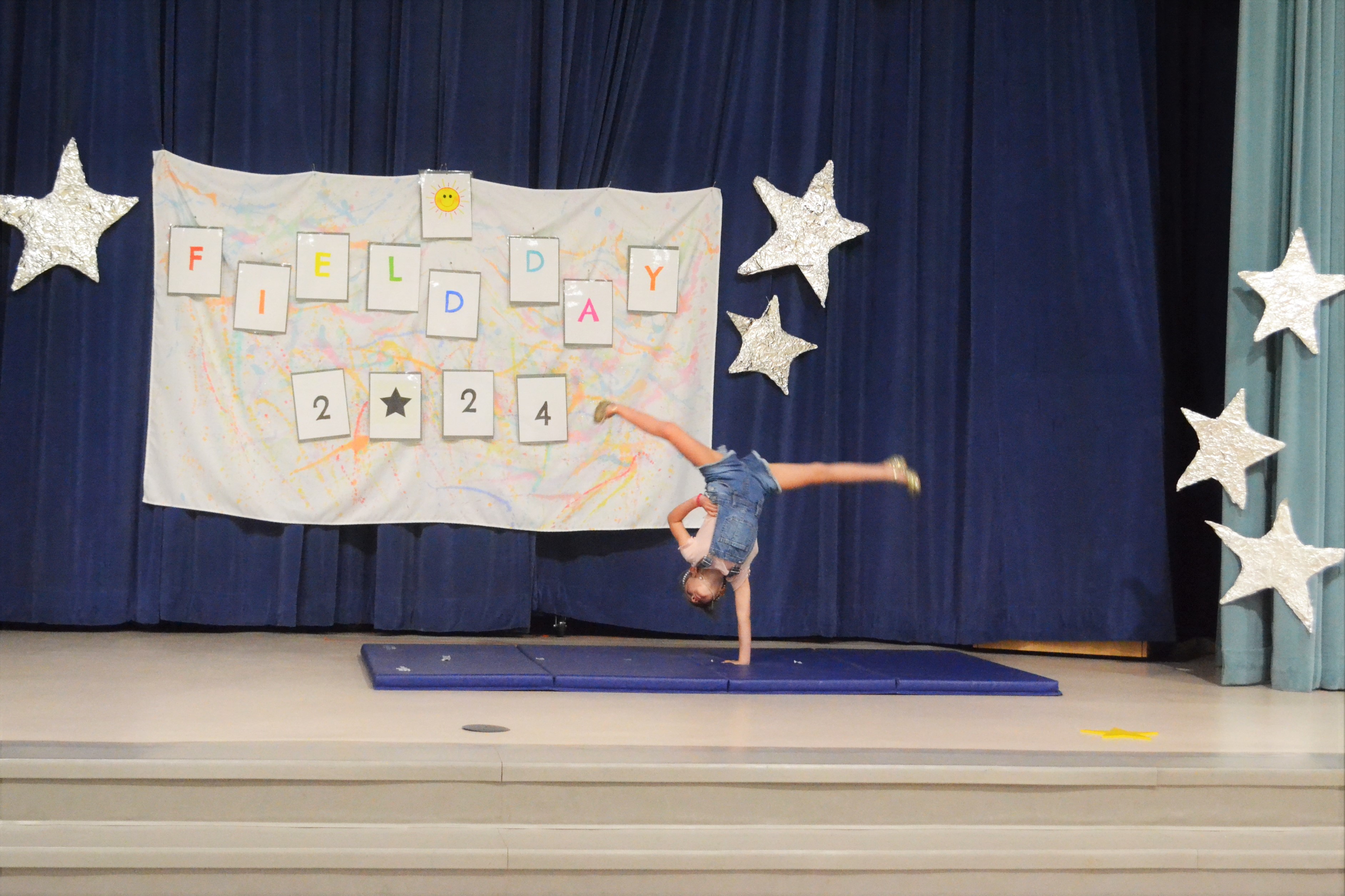 Girl does a one handed cartwheel