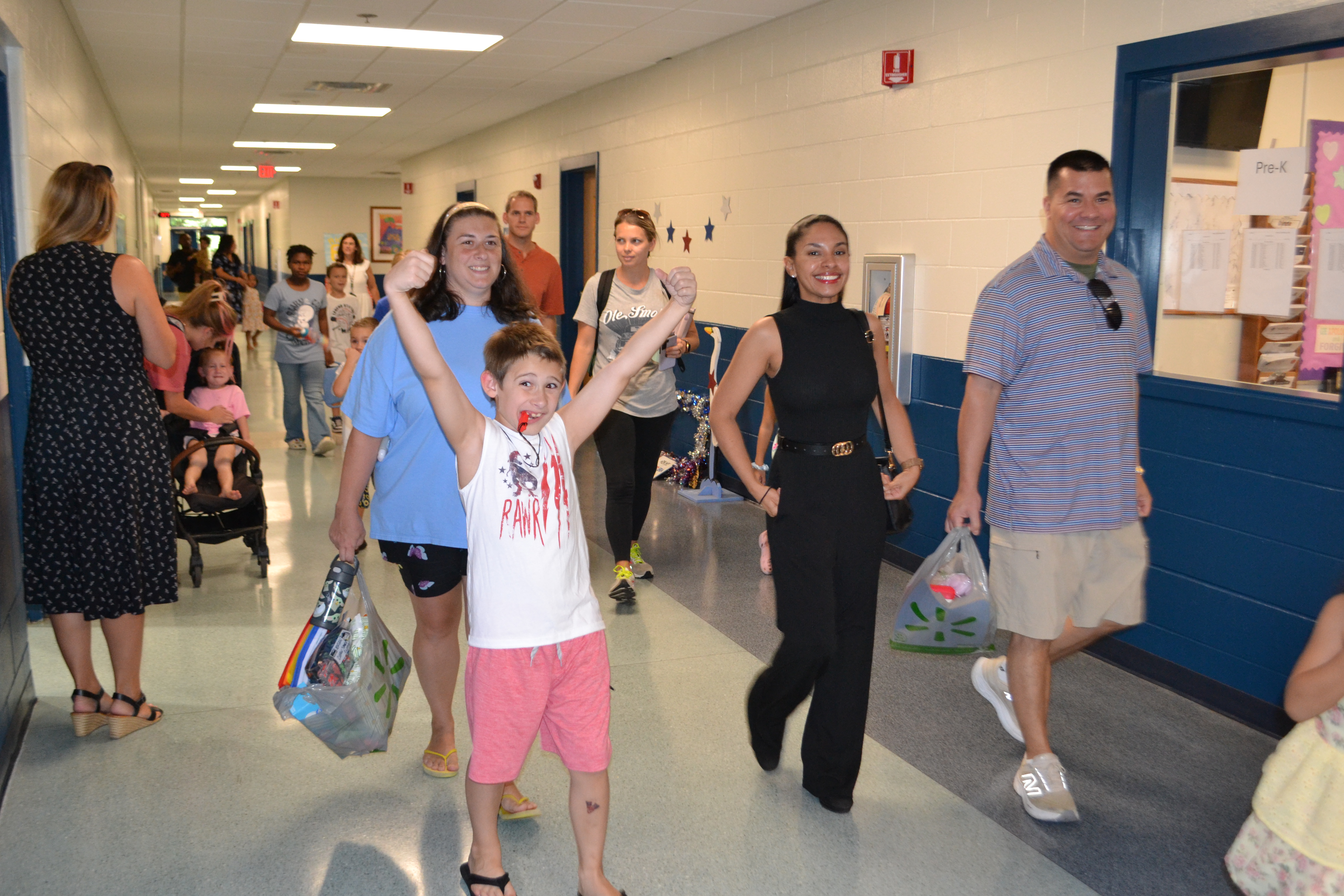 Student stands in excited pose ready for new school year